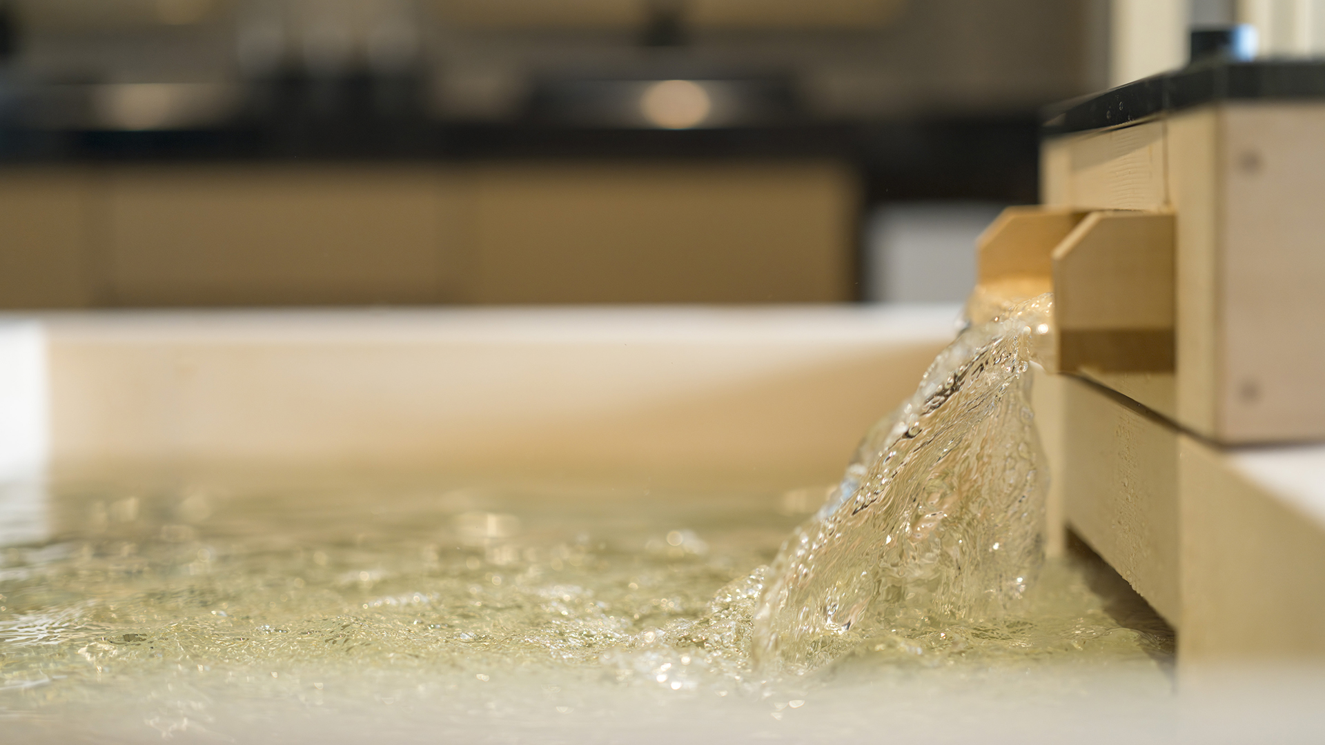 Luxurious suite with bed and sofa overlooking Kyoto cityscape at Banyan Tree Higashiyama Kyoto.